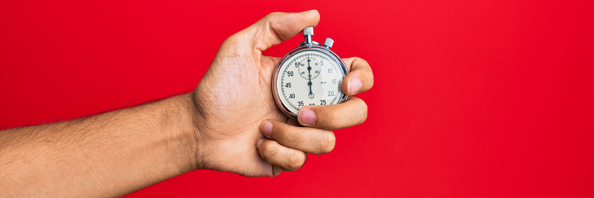 Hand holding a stopwatch