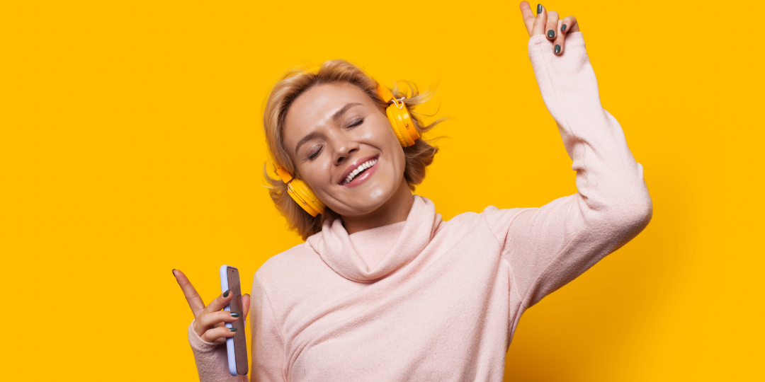 Woman engaging with the audiobook she is listening to. 