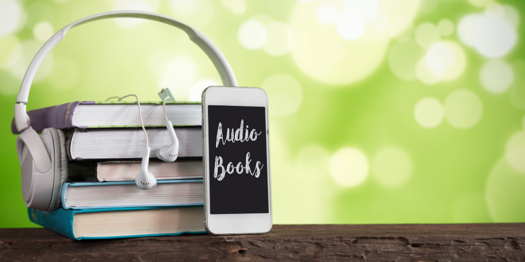 Headphones wrapped around books.