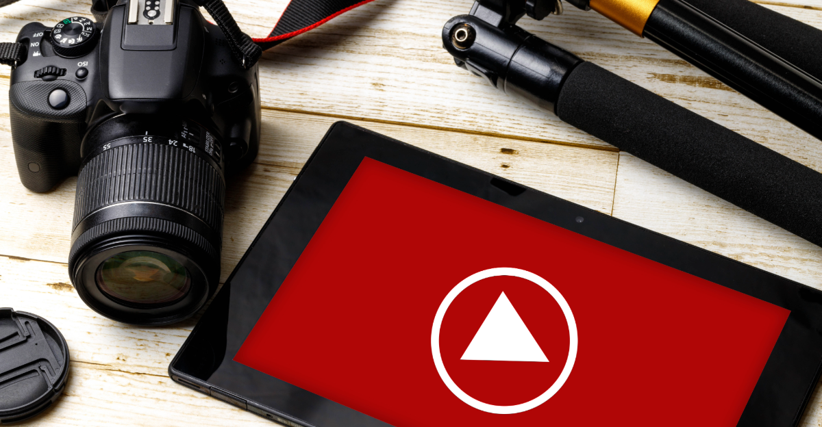Tablet displaying the YouTube logo, camera, and tripod.