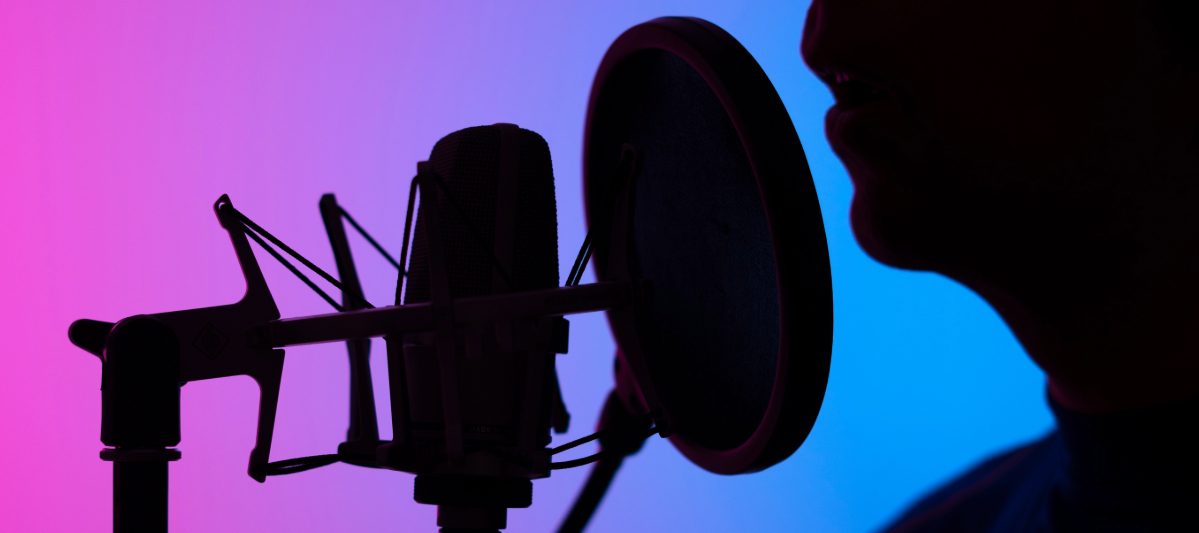 Voice actor on a blue background.